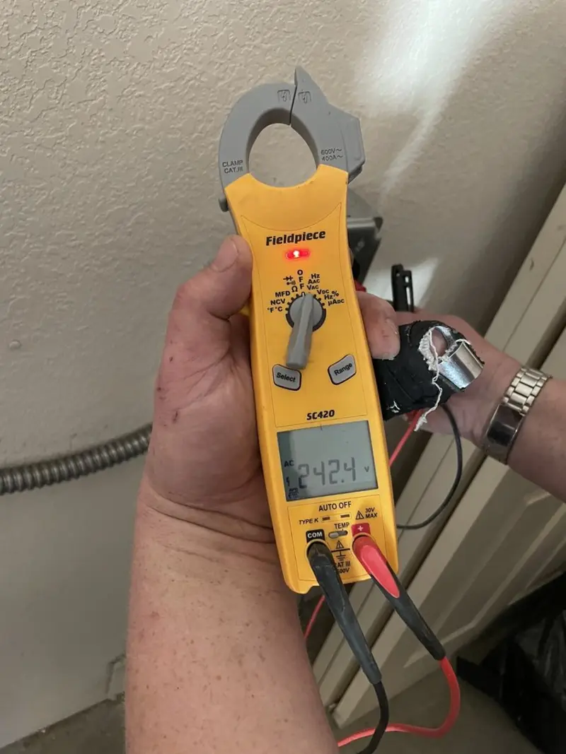 Voltage testing with clamp meter during Recessed Lighting Installation in Branchburg